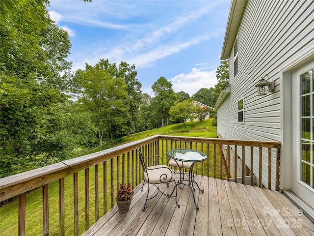 deck featuring a yard