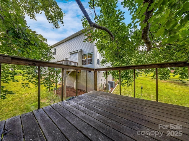 wooden terrace with central air condition unit and a lawn