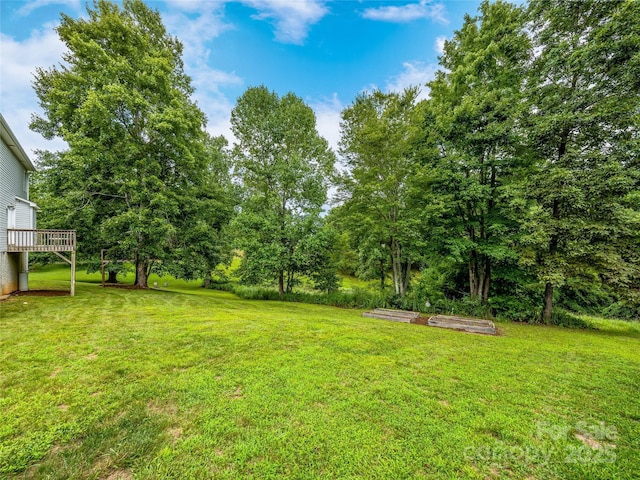 view of yard with a wooden deck