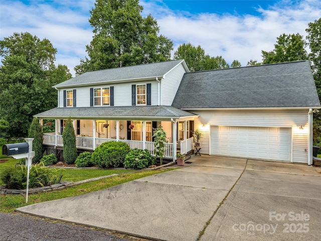 view of front of property with a porch, an attached garage, a shingled roof, concrete driveway, and a front lawn