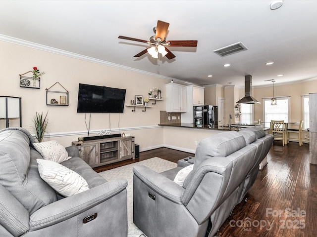 living area with visible vents, ornamental molding, a ceiling fan, recessed lighting, and dark wood-style flooring