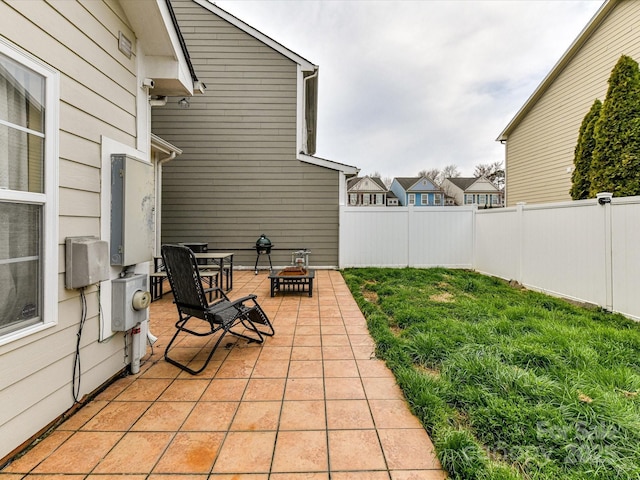 view of patio featuring fence