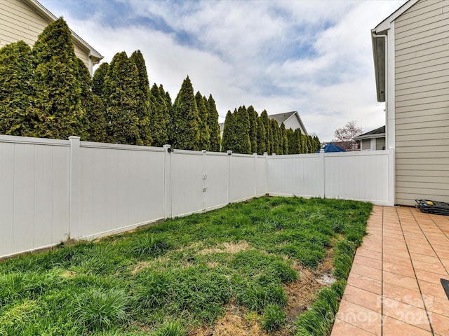 view of yard with a fenced backyard