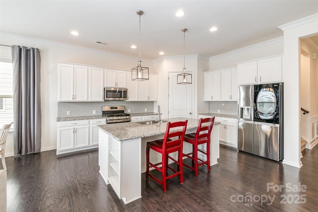 kitchen featuring a sink, stainless steel appliances, white cabinets, and dark wood-style flooring