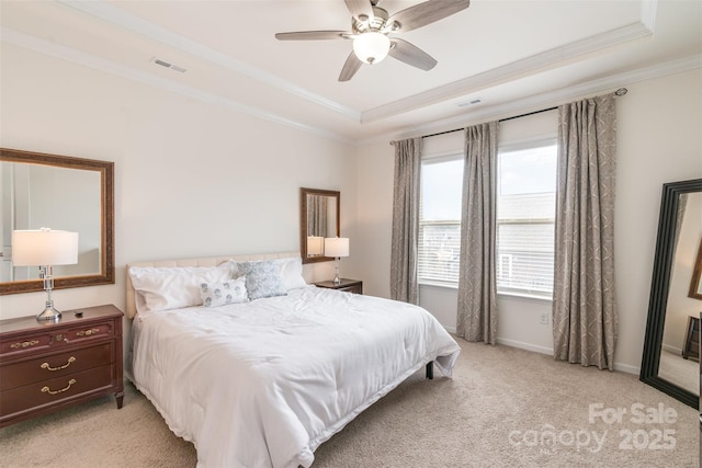 bedroom with light carpet, visible vents, a raised ceiling, and ornamental molding