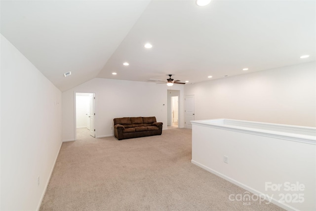 living area featuring visible vents, light carpet, recessed lighting, ceiling fan, and vaulted ceiling