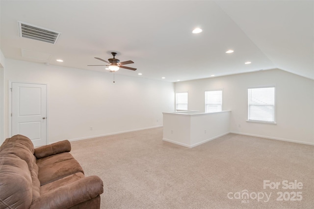 living area featuring light carpet, visible vents, recessed lighting, and baseboards