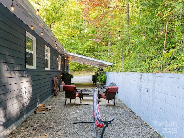 view of patio featuring fence