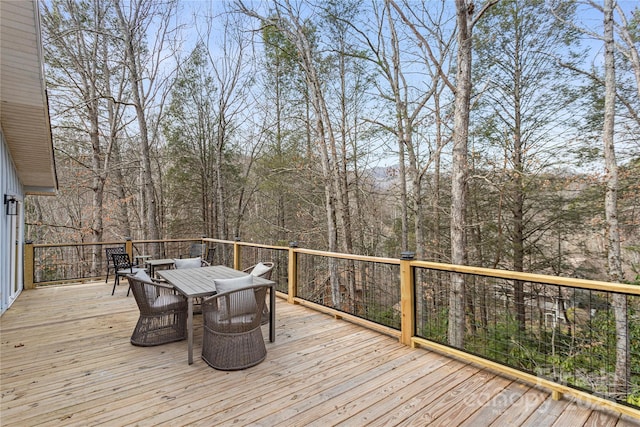 wooden deck with outdoor dining space