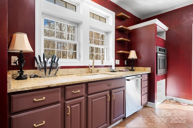 kitchen with light stone countertops, open shelves, a sink, appliances with stainless steel finishes, and crown molding