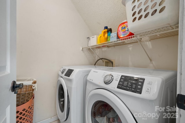 laundry area featuring washer and dryer and laundry area