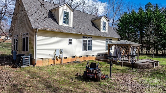 back of property featuring a gazebo, crawl space, central AC unit, and roof with shingles