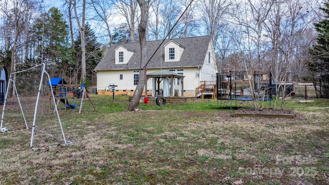 back of house with a trampoline, a playground, a gazebo, a shingled roof, and crawl space