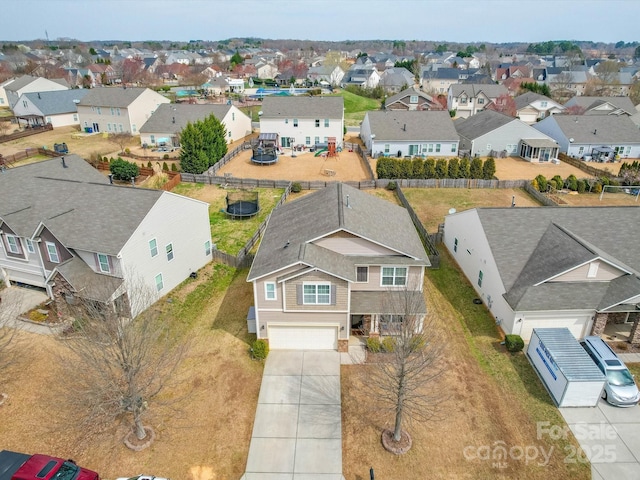 birds eye view of property with a residential view