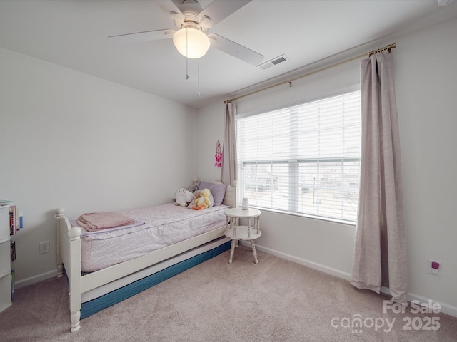 bedroom with visible vents, baseboards, carpet, and a ceiling fan