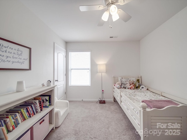 bedroom featuring light carpet, visible vents, baseboards, and a ceiling fan