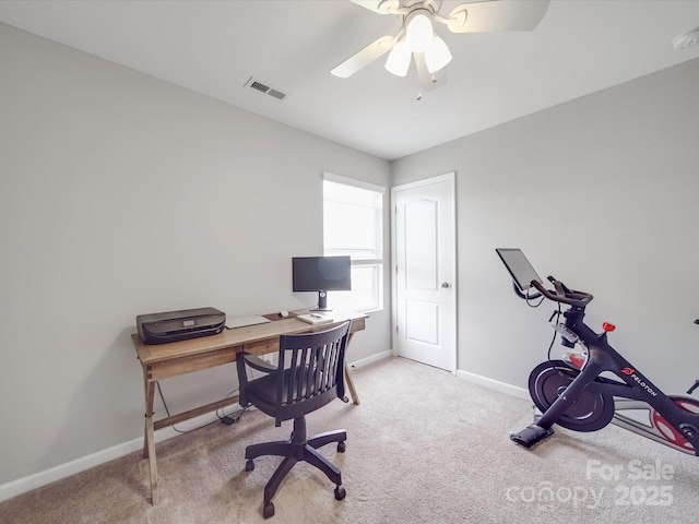 office space featuring carpet flooring, baseboards, visible vents, and ceiling fan