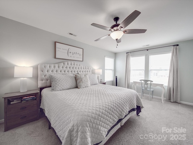 bedroom with visible vents, carpet floors, baseboards, and a ceiling fan