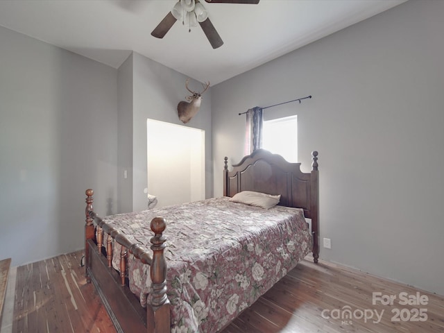 bedroom with wood finished floors and ceiling fan