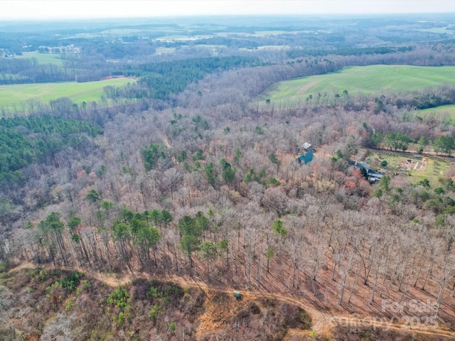 aerial view featuring a view of trees