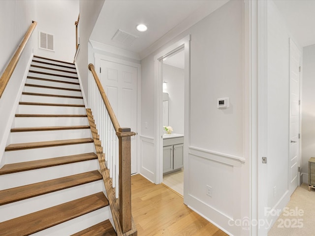 1409 Kenilworth Ave, Charlotte, NC 28203 - staircase featuring wood finished floors and recessed lighting