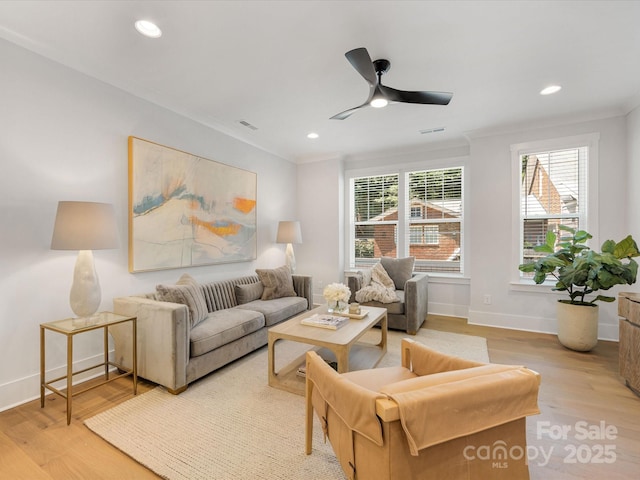 1409 Kenilworth Ave, Charlotte, NC 28203 - living room featuring light wood finished floors, ornamental molding, ceiling fan, and recessed lighting