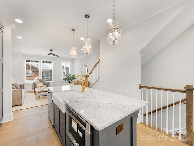 1409 Kenilworth Ave, Charlotte, NC 28203 - kitchen featuring stainless steel microwave, ceiling fan, recessed lighting, light wood-type flooring, and open floor plan