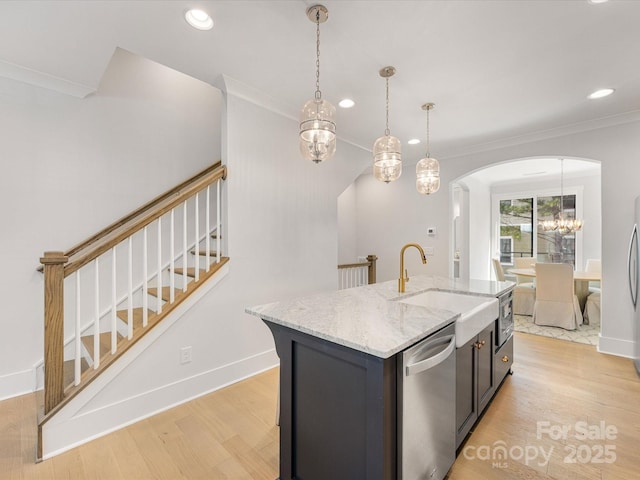 1409 Kenilworth Ave, Charlotte, NC 28203 - kitchen featuring dishwasher, arched walkways, light wood-style floors, recessed lighting, and a chandelier