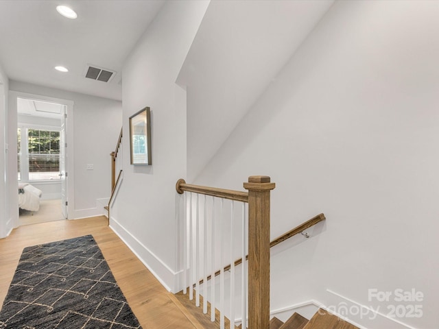 1409 Kenilworth Ave, Charlotte, NC 28203 - stairway featuring recessed lighting and wood finished floors