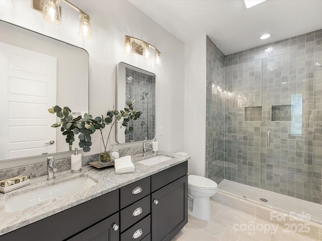 1409 Kenilworth Ave, Charlotte, NC 28203 - bathroom featuring a stall shower, double vanity, tile patterned flooring, and recessed lighting