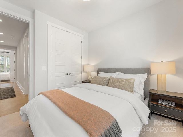 1409 Kenilworth Ave, Charlotte, NC 28203 - bedroom with recessed lighting, a closet, and wood finished floors