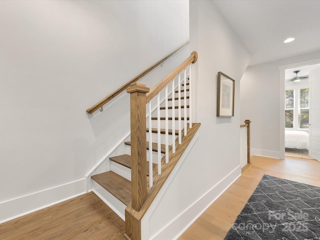 1409 Kenilworth Ave, Charlotte, NC 28203 - staircase with wood finished floors and recessed lighting