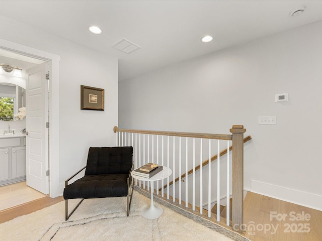 1409 Kenilworth Ave, Charlotte, NC 28203 - sitting room with light wood-style floors and recessed lighting