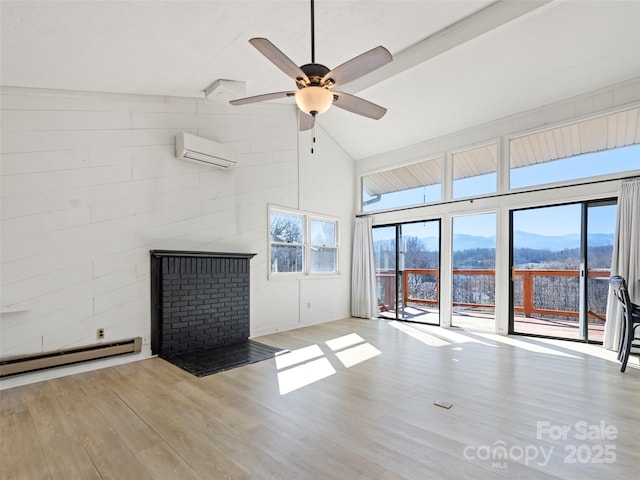 unfurnished living room with a wall mounted air conditioner, a baseboard heating unit, wood finished floors, and ceiling fan