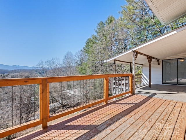 wooden terrace with a mountain view