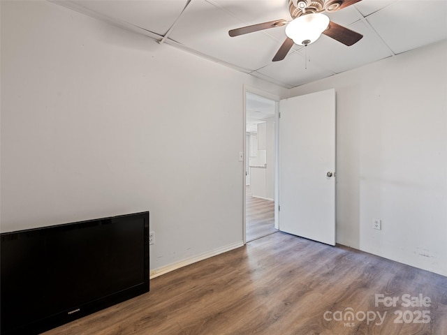 unfurnished room featuring wood finished floors and ceiling fan