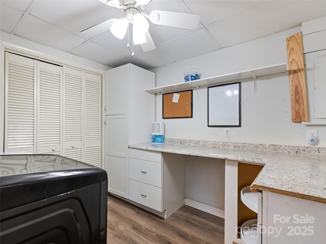 washroom featuring washer / clothes dryer, wood finished floors, a ceiling fan, and laundry area