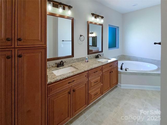 bathroom with a sink, a garden tub, double vanity, and tile patterned floors