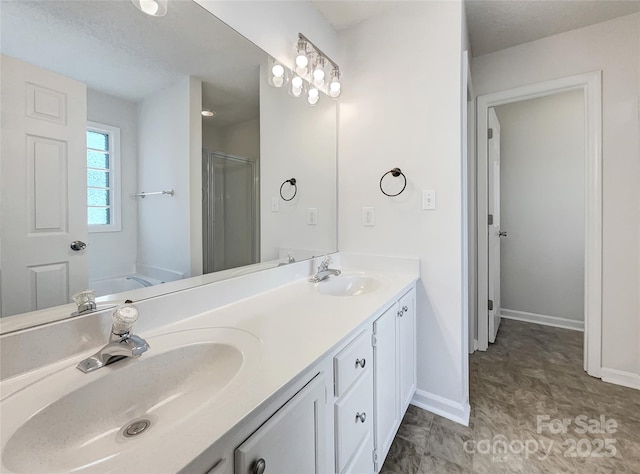 bathroom with double vanity, a shower stall, a bath, and a sink