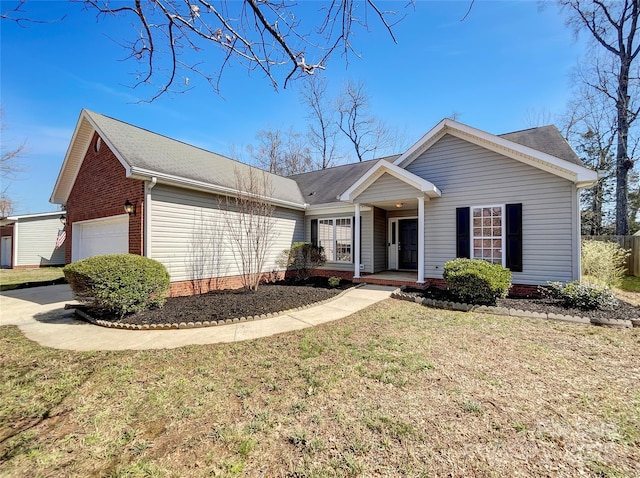 single story home featuring covered porch, an attached garage, a front yard, and roof with shingles