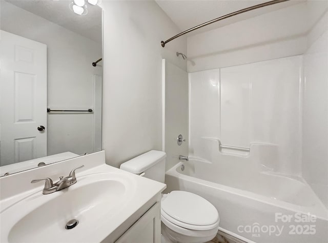 bathroom with vanity, toilet, and washtub / shower combination