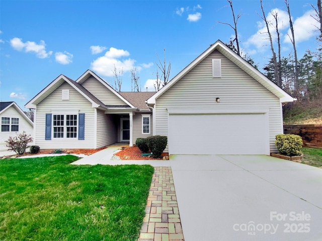 ranch-style house with a garage, concrete driveway, and a front yard