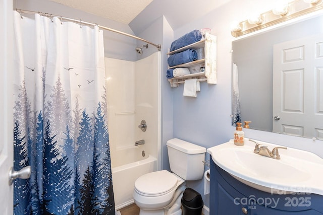 full bath with a textured ceiling, toilet, shower / bath combo with shower curtain, and vanity