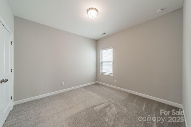 1819 Lotus Ln, Denver, NC 28037 - spare room featuring carpet, baseboards, and a smoke detector