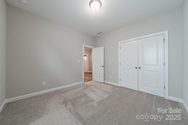 1819 Lotus Ln, Denver, NC 28037 - unfurnished bedroom featuring carpet, baseboards, and a closet
