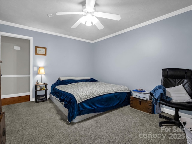 bedroom with ornamental molding, ceiling fan, and carpet floors