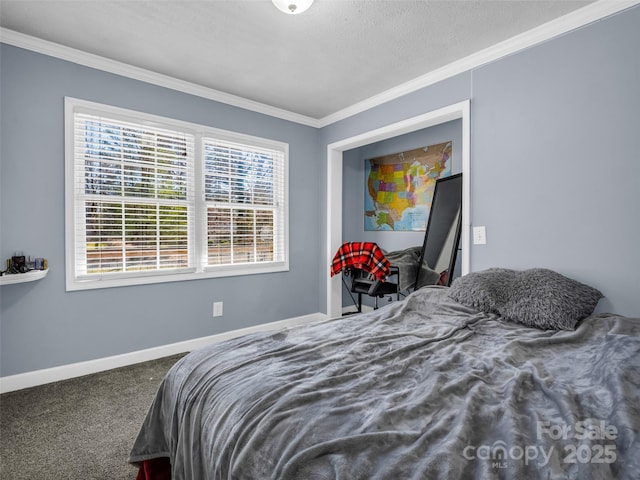 bedroom featuring baseboards, ornamental molding, and carpet flooring