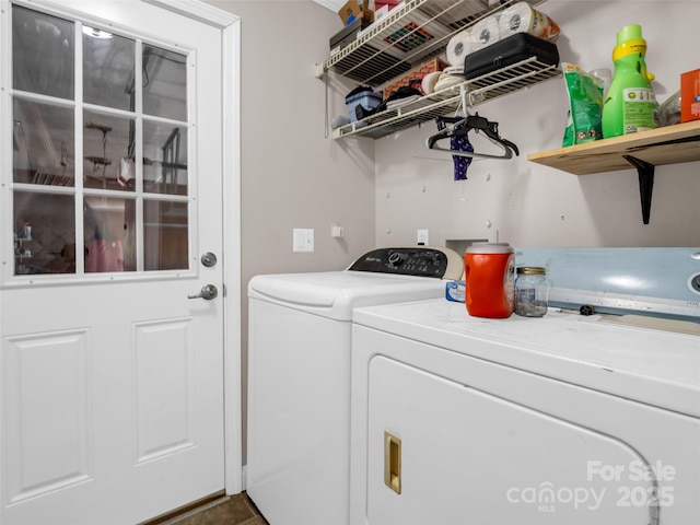 laundry room with laundry area and washing machine and clothes dryer