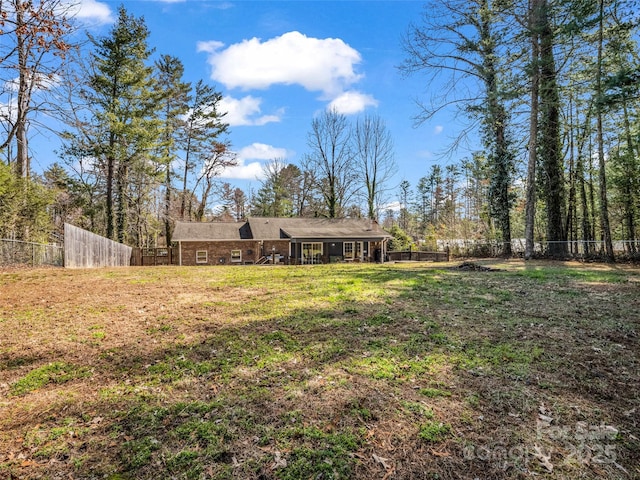 view of yard with a fenced backyard