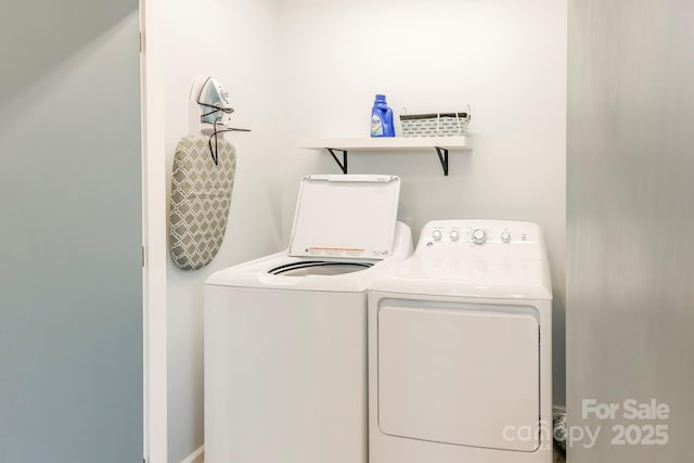laundry room with laundry area and washing machine and dryer